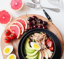 bowl of vegetable salad and fruits